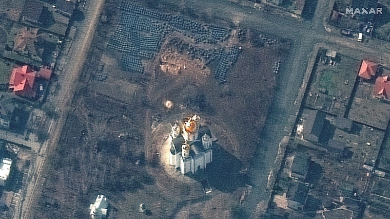 RUSSIANS INVADE UKRAINE    MARCH 31, 2022:  02 Maxar satellite imagery closer view of probable grave site and the church of St. Andrew and Pyervozvannoho, bucha Ukraine.  31march2022wv3.   Please use: Satellite image (c) 2022 Maxar Technologies.